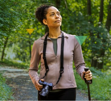 Middle-Aged Woman Hiking in the Forest LOKELMA FAQ Banner